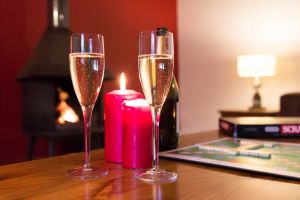 Enjoy a glass of something refreshing in front of a cosy fire