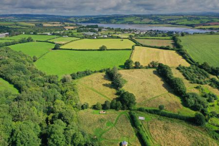 View for the air showing River Tamar curling around towards the North of the farm